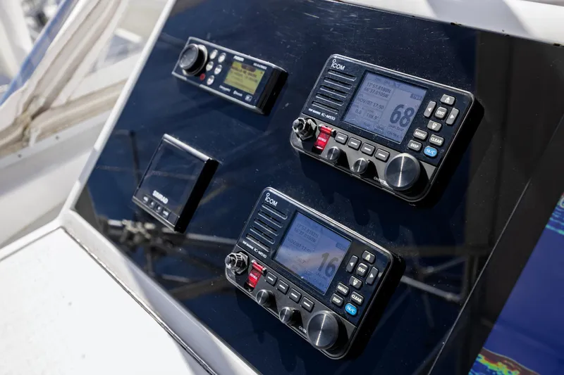 Slide: The Image of Control panel of 2005 Hatteras 50 Convertible yacht with navigation equipment. - 64