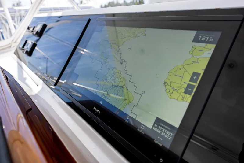 Slide: The Image of Navigation display on 2005 Hatteras 50 Convertible yacht, featuring Garmin marine electronics. - 65