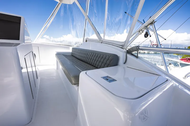 Slide: The Image of 2005 Hatteras 50 Convertible yacht interior with sleek seating and ocean view. - 66