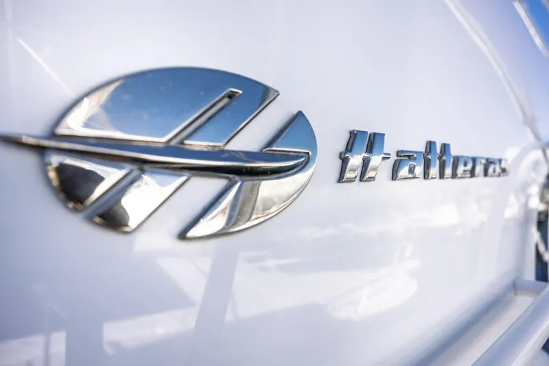 Slide: The Image of Close-up of 2005 Hatteras 50 Convertible logo on white surface. - 67