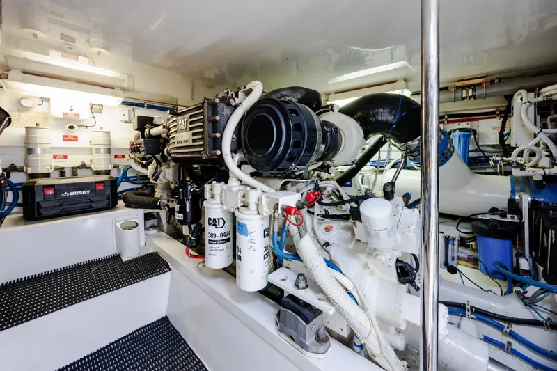 Slide: The Image of Engine room of 2005 Hatteras 50 Convertible yacht, featuring CAT marine power systems. - 94