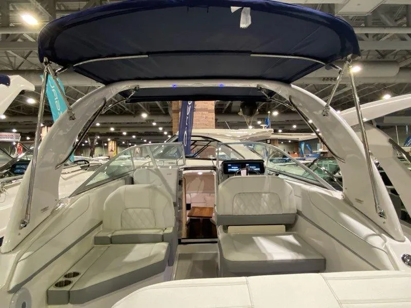 Slide: The Image of Interior of 2026 Regal 26 XO boat with modern dashboard and steering wheel. - 12