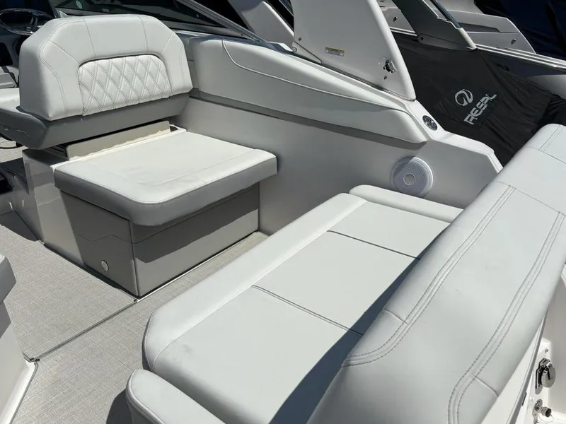 Slide: The Image of Interior view of 2026 Regal 26 XO boat cockpit with steering wheel and controls. - 2
