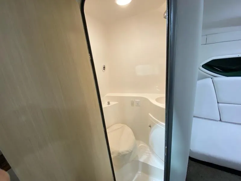 Slide: The Image of 2026 Regal 26 XO boat interior bathroom with modern design and compact layout. - 25