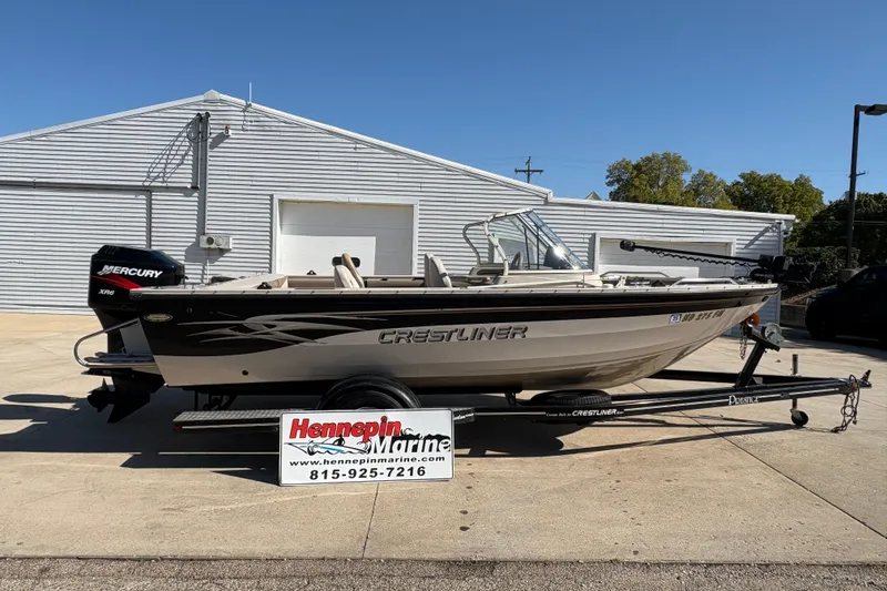 Slide: The Image of 2001 Crestliner 1900 PHANTOM SST boat on trailer, displayed at Hennepin Marine dealership. - 1