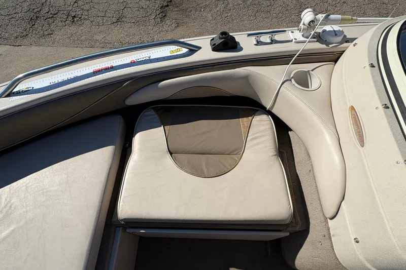Slide: The Image of Crestliner 1900 PHANTOM SST 2001 boat interior with cushioned seating and measuring ruler. - 13