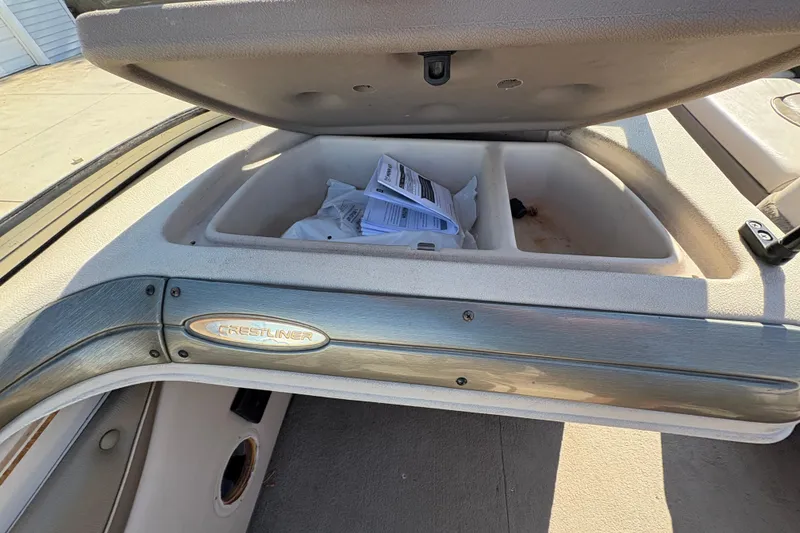 Slide: The Image of Open storage compartment in 2001 Crestliner 1900 PHANTOM SST boat, showing interior details. - 20