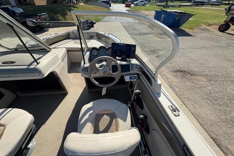 Slide: The Image of 2001 Crestliner 1900 PHANTOM SST boat interior with steering wheel and dashboard controls. - 21