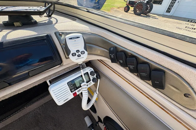 Slide: The Image of Interior of 2001 Crestliner 1900 PHANTOM SST boat with radio and control switches. - 24