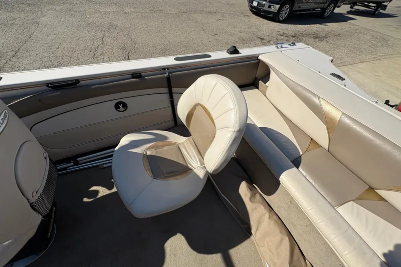 Slide: The Image of 2001 Crestliner 1900 PHANTOM SST boat interior with beige seating and carpet. - 25