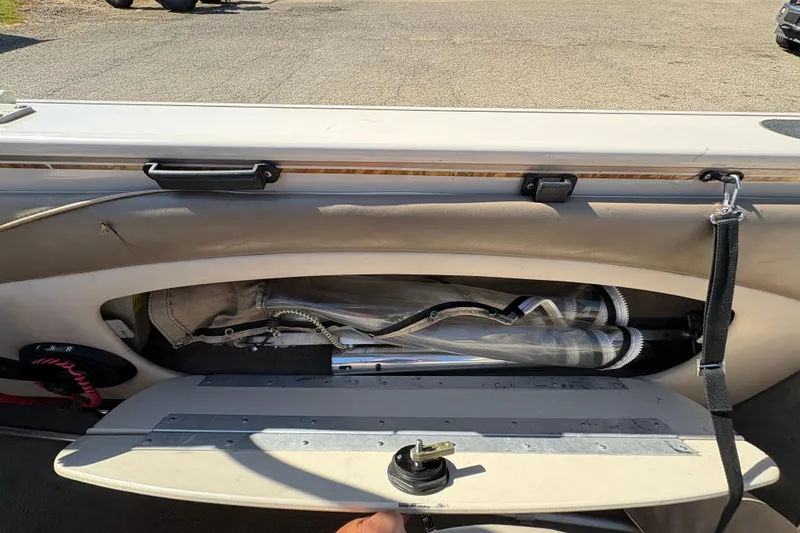 Slide: The Image of 2001 Crestliner 1900 PHANTOM SST boat interior storage compartment with equipment. - 26