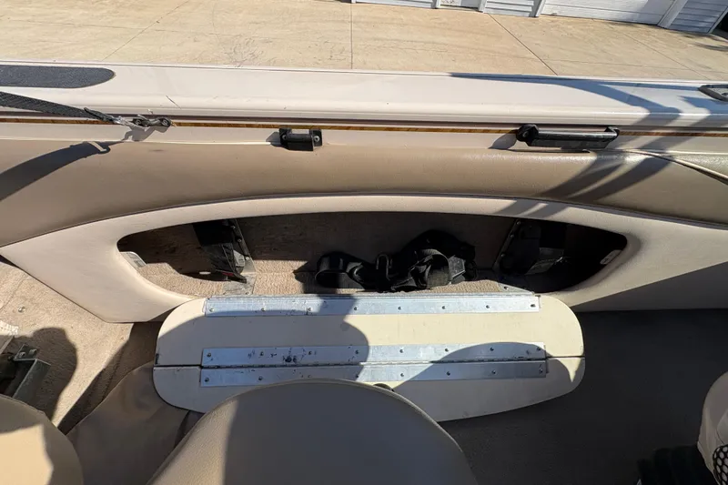Slide: The Image of 2001 Crestliner 1900 PHANTOM SST boat interior with storage compartment and seating. - 28