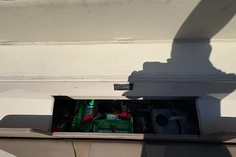Slide: The Image of Storage compartment of 2001 Crestliner 1900 PHANTOM SST boat with batteries and equipment. - 29