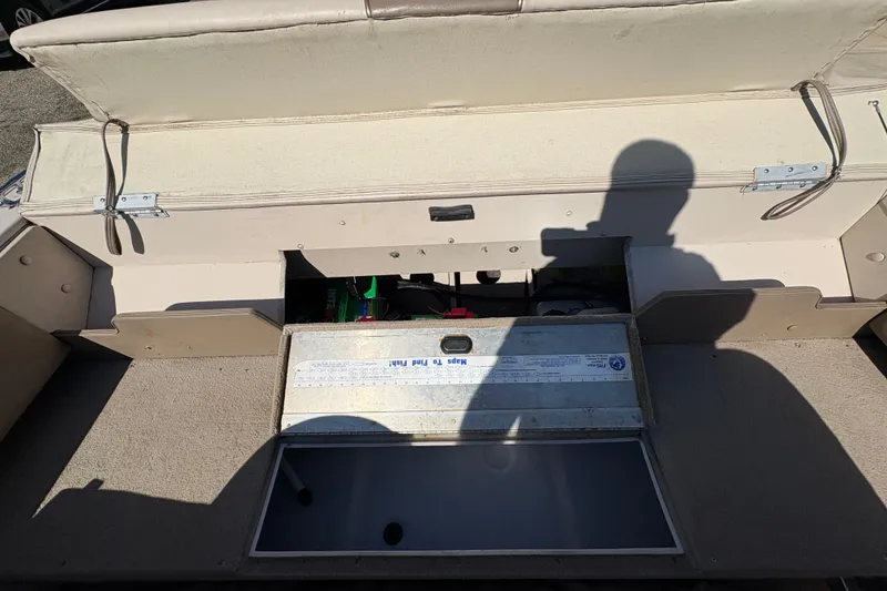 Slide: The Image of 2001 Crestliner 1900 PHANTOM SST boat interior with open storage compartment. - 30