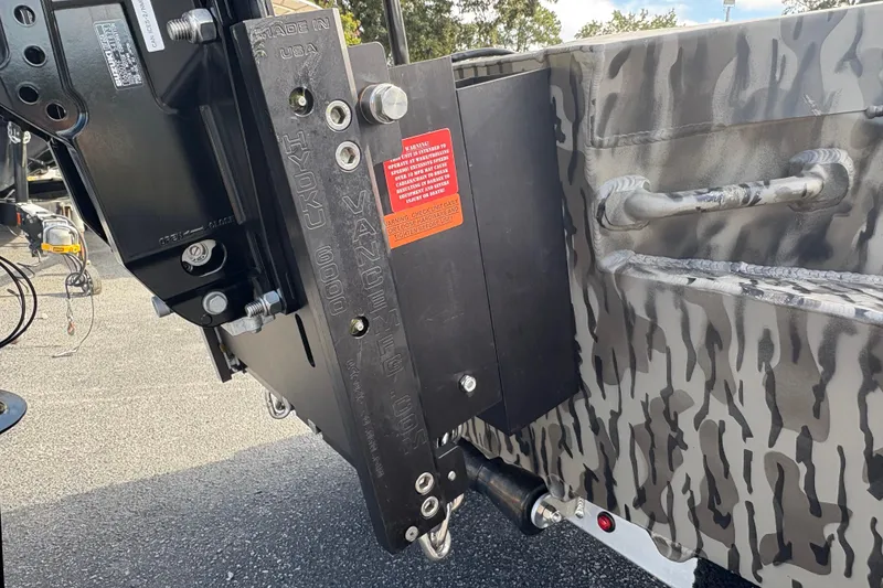 Slide: The Image of 2025 Edge Duck Boats 756DB, camouflage design, featuring hydraulic components and warning label. - 13