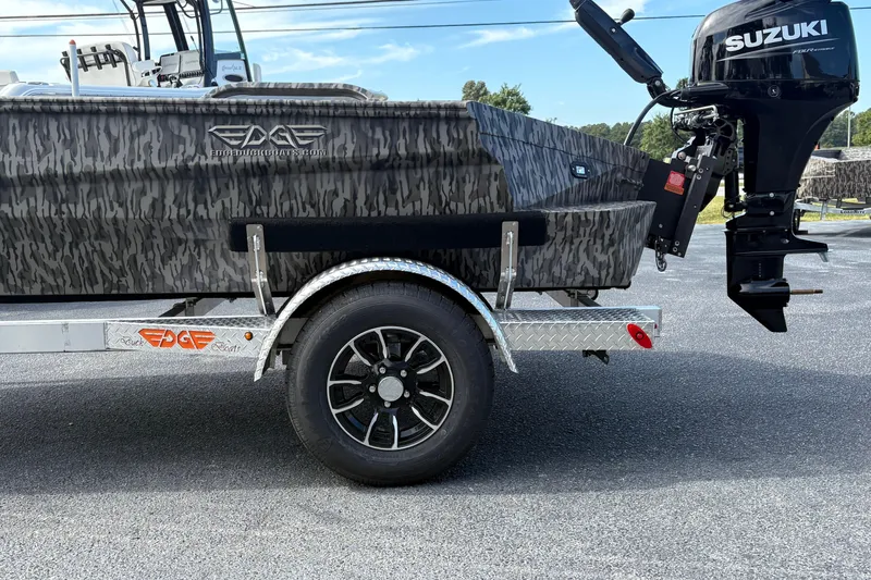 Slide: The Image of 2025 Edge Duck Boats 756DB with Suzuki outboard motor on a trailer. - 2