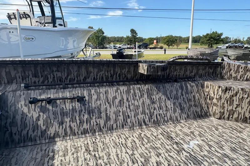 Slide: The Image of 2025 Edge Duck Boats 756DB with camouflage interior, parked outdoors under clear sky. - 8