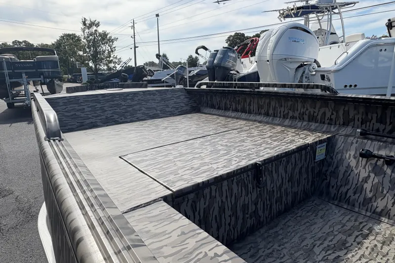 Slide: The Image of 2025 Edge Duck Boats 756DB with camouflage design, parked outdoors. - 9