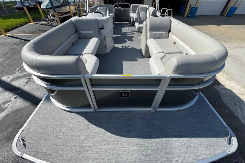 Slide: The Image of 2026 Sweetwater EX2286SBX pontoon boat with spacious seating and modern design. - 5