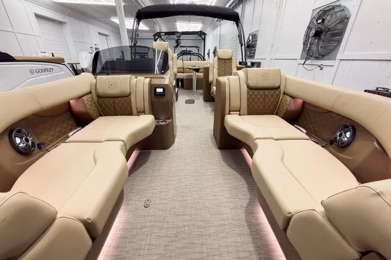 Slide: The Image of Luxurious interior of 2026 Godfrey Sanpan 23' Ultra Lounge Tritoon with plush seating and modern design. - 11