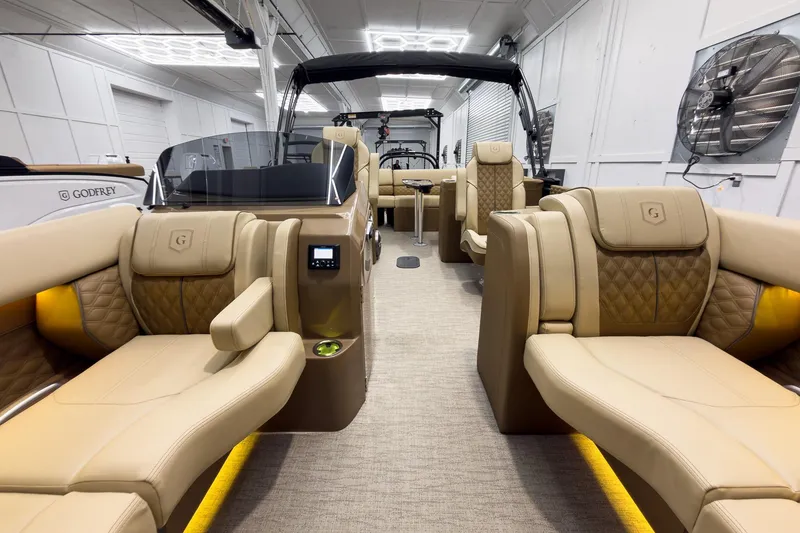 Slide: The Image of Luxurious interior of 2026 Godfrey Sanpan 23' Ultra Lounge Tritoon with plush seating. - 12