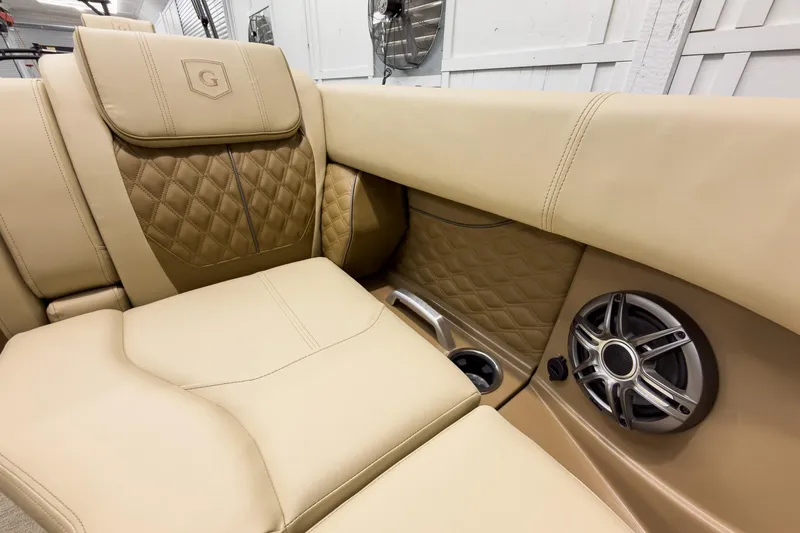 Slide: The Image of Luxurious tan seating in 2026 Godfrey Sanpan 23' Ultra Lounge Tritoon with speaker detail. - 15