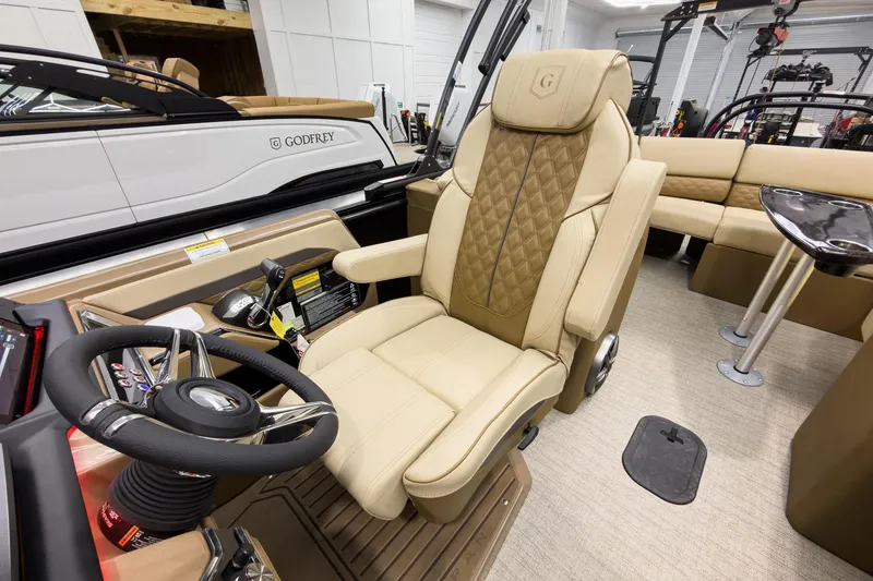 Slide: The Image of Luxurious interior of 2026 Godfrey Sanpan 23' Ultra Lounge Tritoon boat, featuring plush seating. - 19