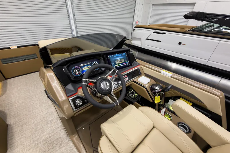 Slide: The Image of Interior view of 2026 Godfrey Sanpan 23' Ultra Lounge Tritoon, featuring modern dashboard and controls. - 21