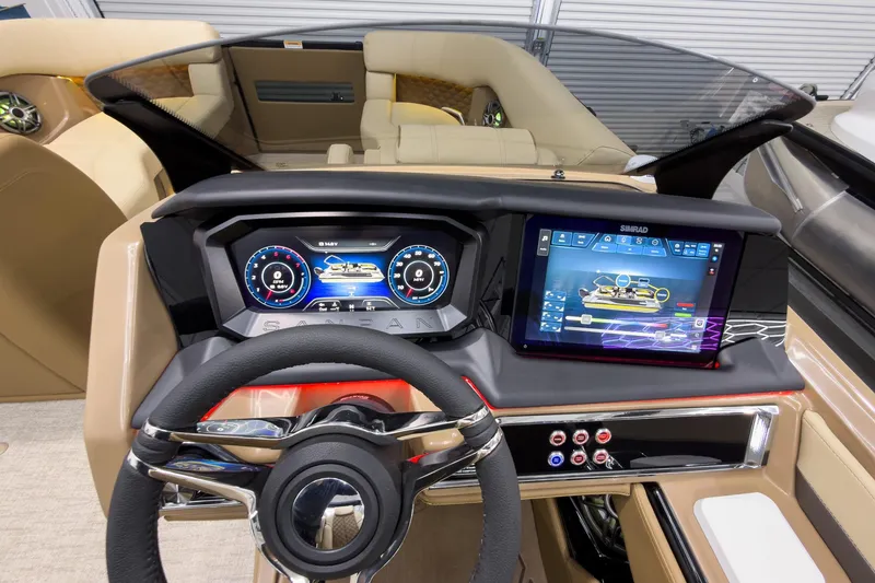 Slide: The Image of 2026 Godfrey Sanpan 23' Ultra Lounge Tritoon dashboard with advanced digital displays and controls. - 22