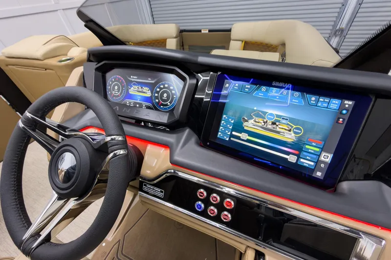 Slide: The Image of 2026 Godfrey Sanpan 23' Ultra Lounge Tritoon dashboard with advanced digital controls and steering wheel. - 23