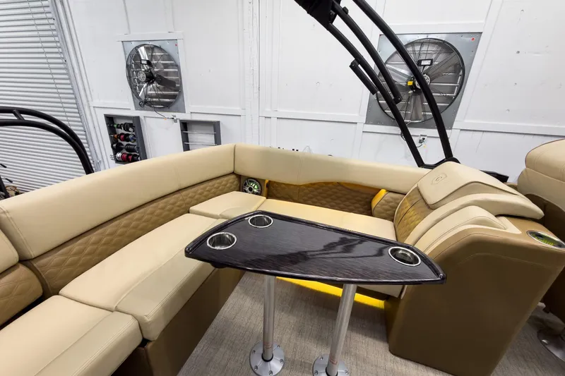 Slide: The Image of Luxurious interior of 2026 Godfrey Sanpan 23' Ultra Lounge Tritoon with elegant seating and table. - 36