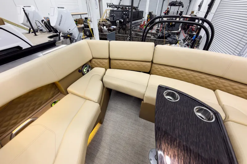 Slide: The Image of Luxurious interior of 2026 Godfrey Sanpan 23' Ultra Lounge Tritoon with plush seating and cup holders. - 37