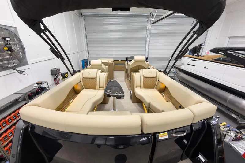 Slide: The Image of 2026 Godfrey Sanpan 23' Ultra Lounge Tritoon interior with luxurious seating and modern design. - 42