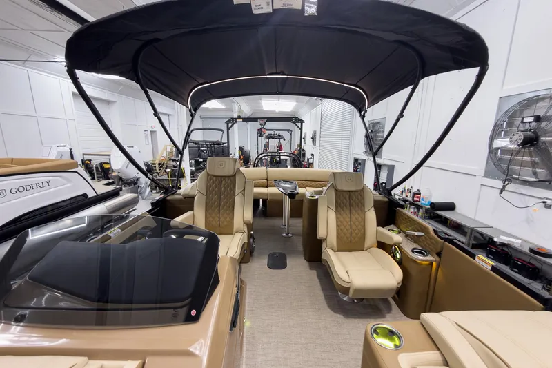 Slide: The Image of Luxurious 2026 Godfrey Sanpan 23' Ultra Lounge Tritoon interior with plush seating and canopy. - 44