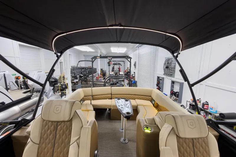 Slide: The Image of Luxurious interior of 2026 Godfrey Sanpan 23' Ultra Lounge Tritoon boat in a showroom. - 45