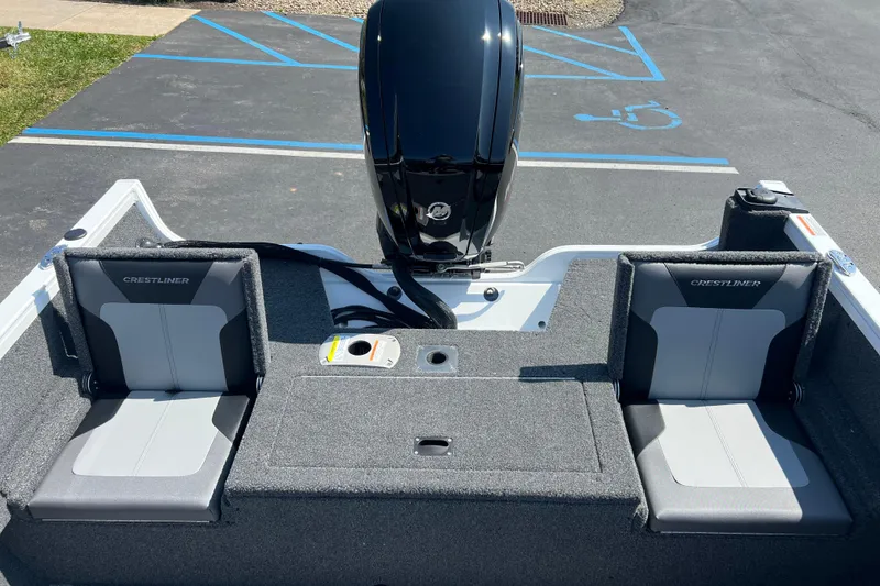 Slide: The Image of 2024 Crestliner 1650 HAWK SC boat interior with dual seats and motor view. - 10