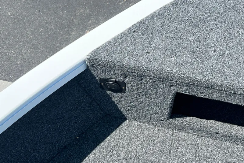 Slide: The Image of 2024 Crestliner 1650 HAWK SC boat interior with carpeted storage compartment. - 4