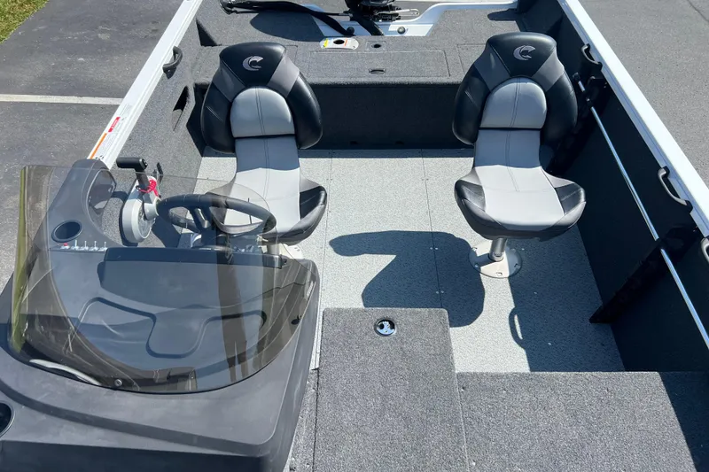 Slide: The Image of 2024 Crestliner 1650 HAWK SC boat interior with dual seats and steering console. - 7