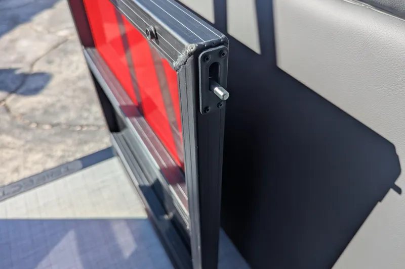 Slide: The Image of Close-up of a 2026 Trifecta 21C SS boat component with red and gray details. - 11