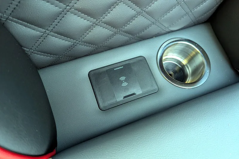 Slide: The Image of Luxury car interior with wireless charger and cup holder, Trifecta 21C SS, 2026 model. - 13