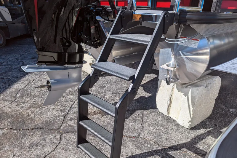 Slide: The Image of Ladder and motor of 2026 Trifecta 21C SS pontoon boat on display. - 19
