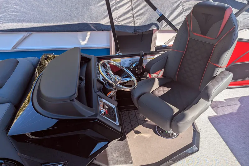 Slide: The Image of Captain's seat and helm of 2026 Trifecta 21C SS boat, featuring modern design and controls. - 2