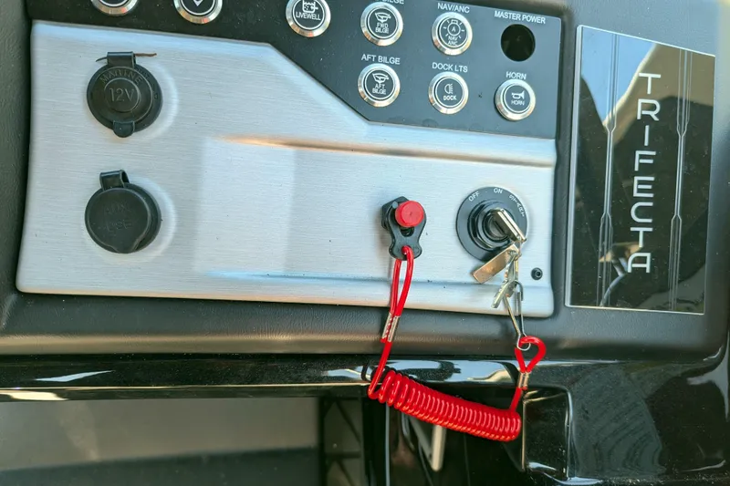 Slide: The Image of Control panel of 2026 Trifecta 21C SS boat with ignition and switches. - 4