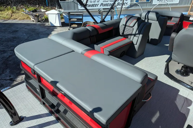 Slide: The Image of 2026 Trifecta 21C SS pontoon boat with modern gray and red seating. - 8