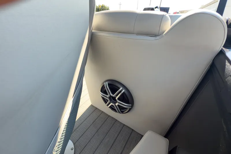 Slide: The Image of 2024 Godfrey Sweetwater 22' boat interior with speaker on split bench backrest. - 15