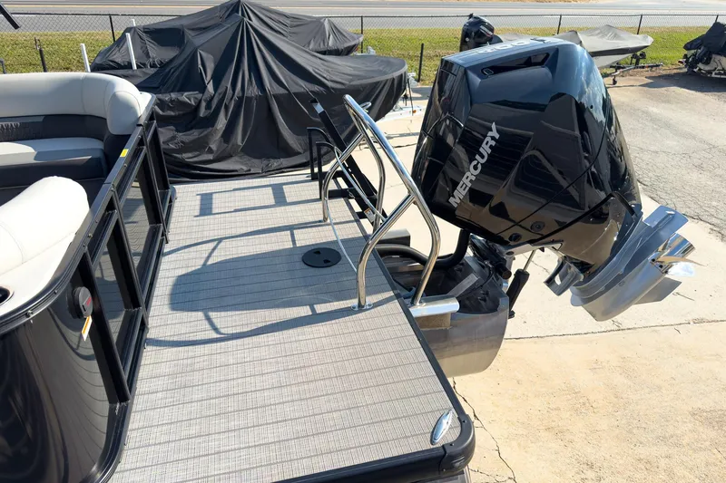 Slide: The Image of 2024 Godfrey Sweetwater 22' pontoon boat with Mercury 400 V10 engine, docked outdoors. - 20