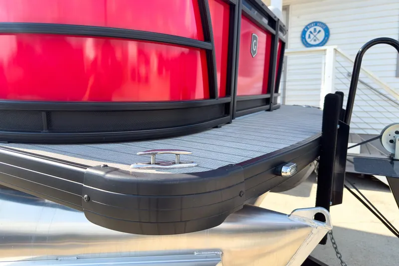 Slide: The Image of 2024 Godfrey Sweetwater 22' pontoon boat with red exterior and sleek deck design. - 26