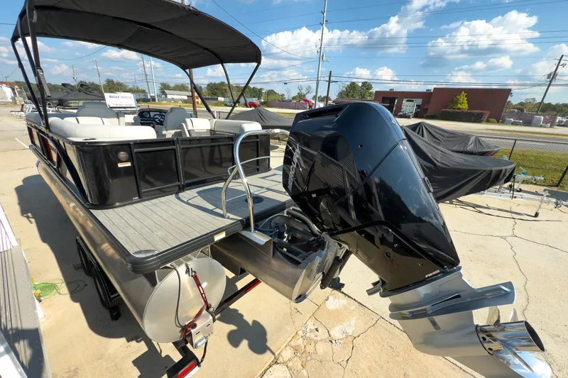 Slide: The Image of 2024 Godfrey Sweetwater 22' pontoon boat with Mercury 400 V10 engine, docked outdoors. - 3