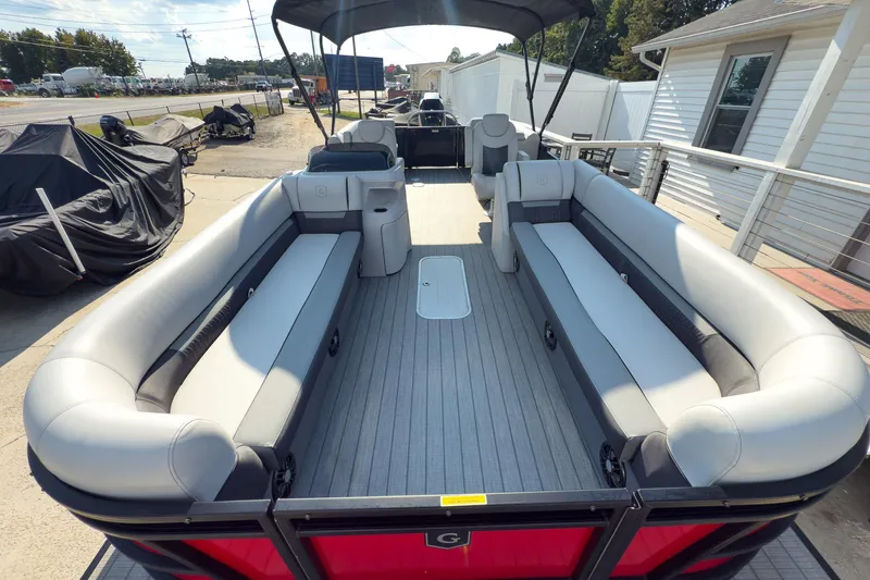 Slide: The Image of 2024 Godfrey Sweetwater 22' pontoon boat with spacious seating and modern design. - 7