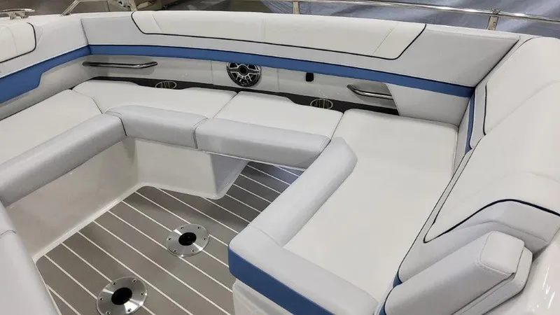 Slide: The Image of 2025 Formula 330 Crossover Bowrider OB interior with white and blue seating. - 14